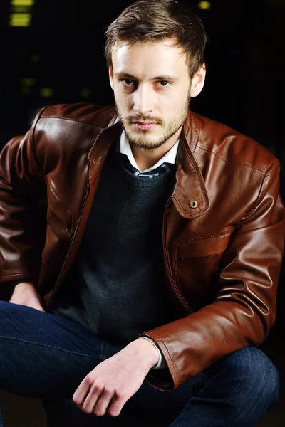Fashionable young man with leather clothes on — Stock Photo, Image