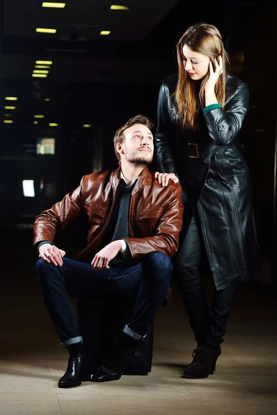 Fashionable young couple with leather clothes on — Stock Photo, Image