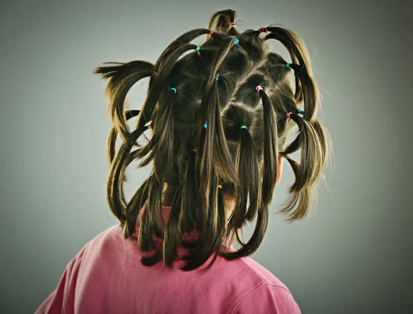 Retrato engraçado de criança com penteado — Fotografia de Stock