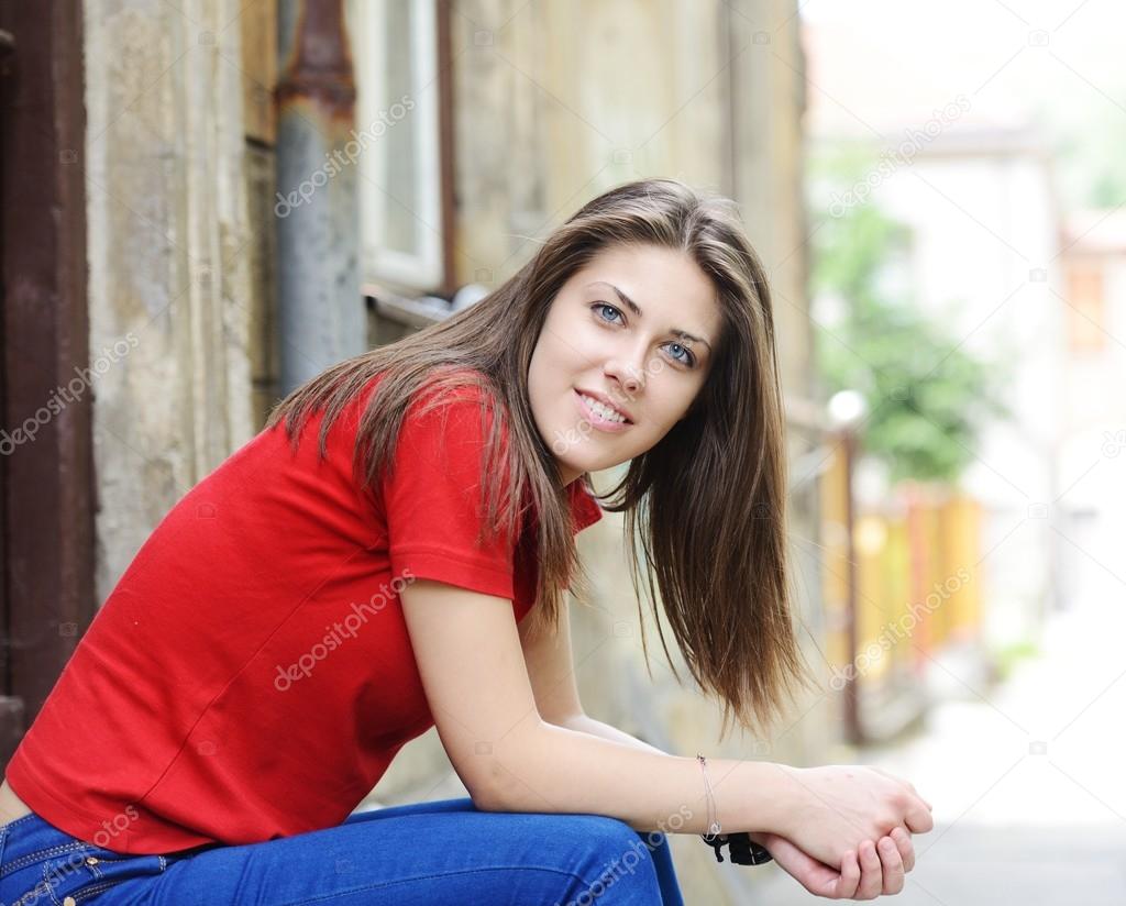 Young girl on the street posing for photos