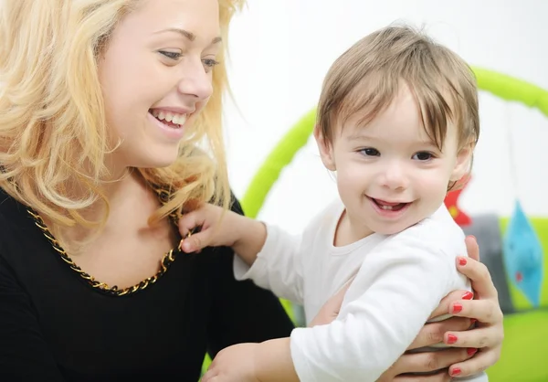 Baby with mom in bedroom — Stock Photo, Image