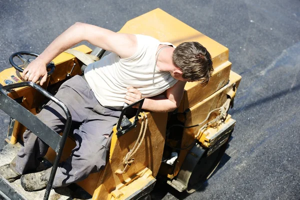 Hard work on asphalt construction — Stock Photo, Image