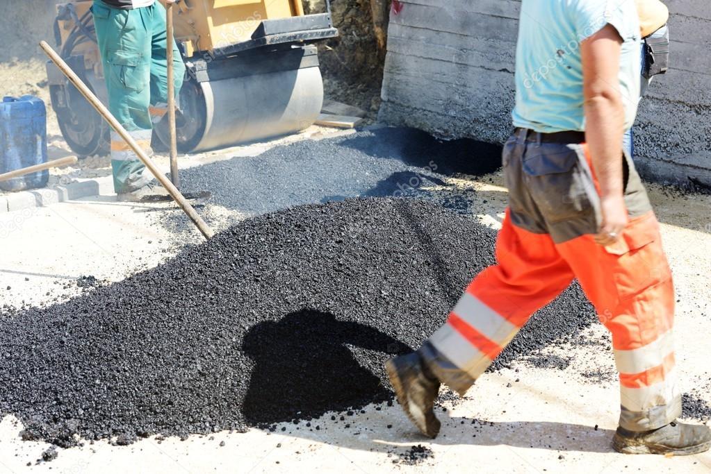 Hard work on asphalt construction