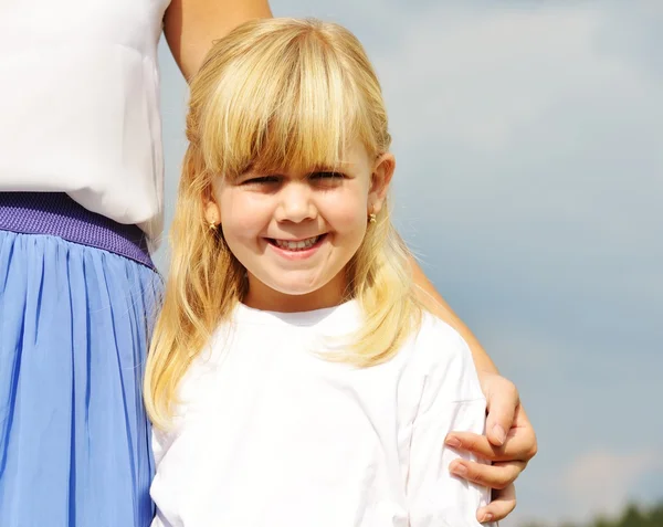 Llittle blonde girl on summer grass meadow — Stock Photo, Image