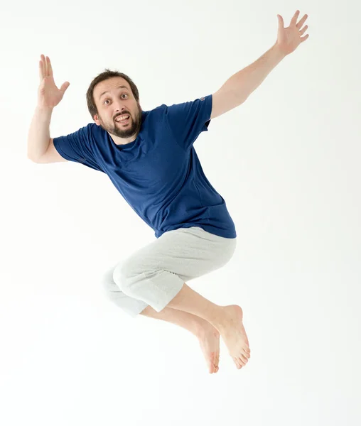 Чоловік стрибає і робить жести і вирази — стокове фото