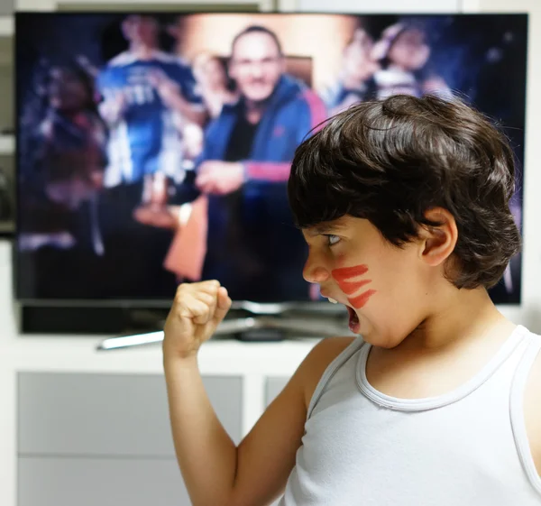 Kid watching football world cup game on tv — Stock Photo, Image