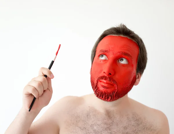 Ζωγραφική σε κόκκινο άνθρωπος της όψη — Φωτογραφία Αρχείου