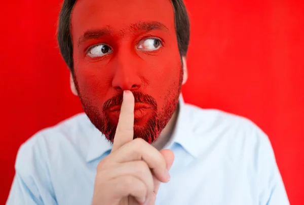 Young man portait with red painted face — Stock Photo, Image