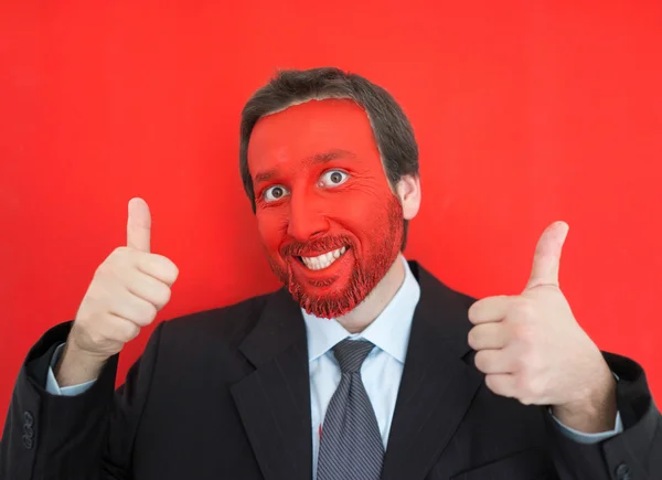 Young man portait with red painted face — Stock Photo, Image
