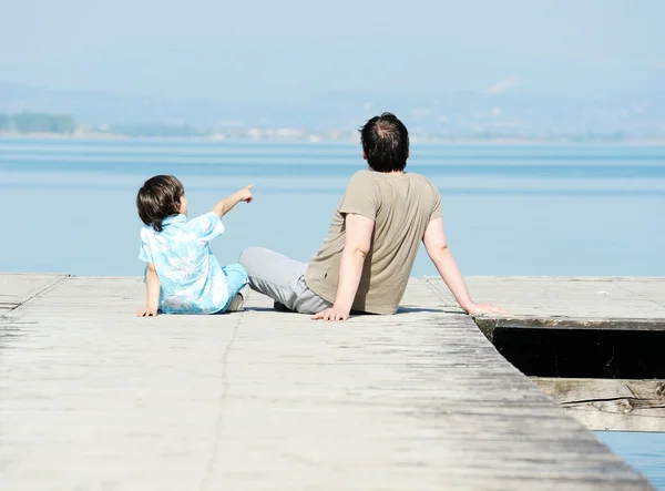 Dad and son on the dock — Stock Photo, Image