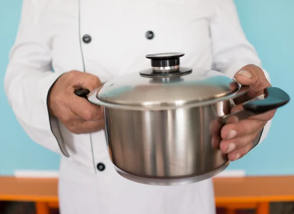 Senior cook with pan — Stock Photo, Image