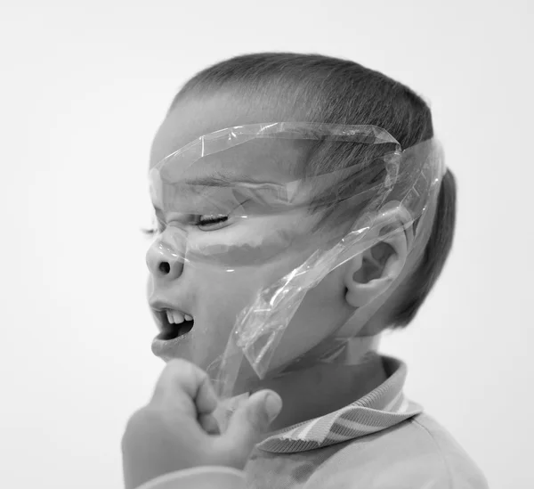 Funny two years old boy with tape on his face — Stock Photo, Image