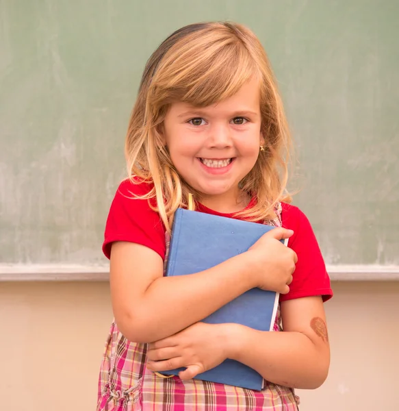 Cute little blonde school girl — Stock Photo, Image