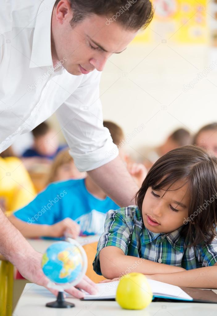 Teacher working with children