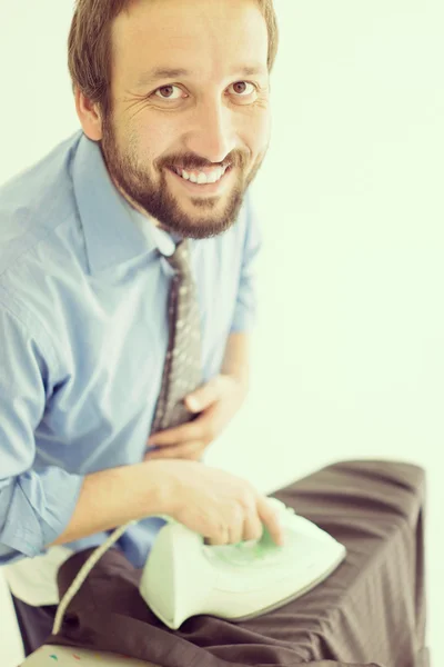 Man ironing his suit — Stock Photo, Image