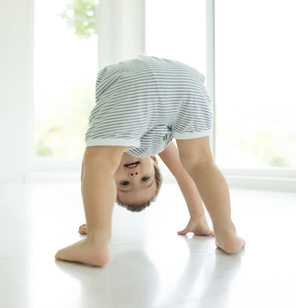 Happy little child upside down — Stock Photo, Image