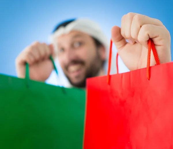 Arabische man met shopping tassen — Stockfoto