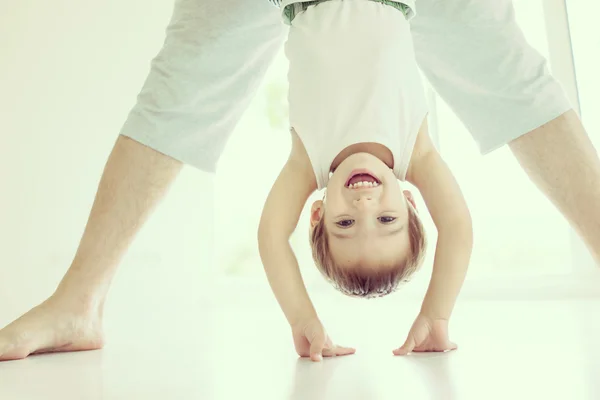 Happy little child upside down — Stock Photo, Image