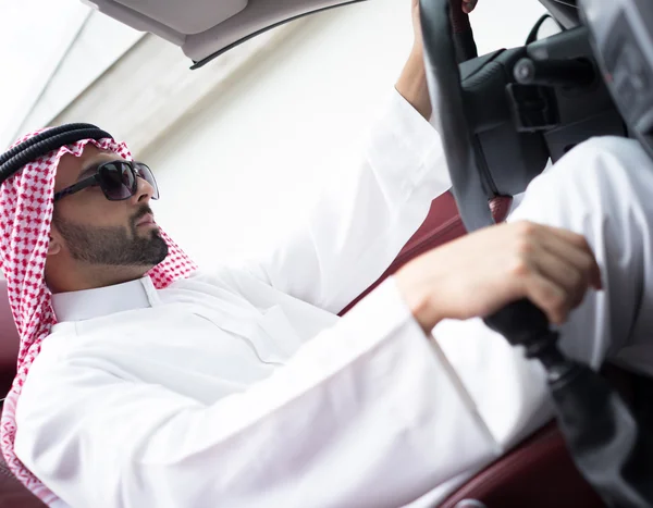 Arabic young businessman driving car — Stock Photo, Image