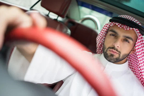 Arabic young businessman driving car — Stock Photo, Image