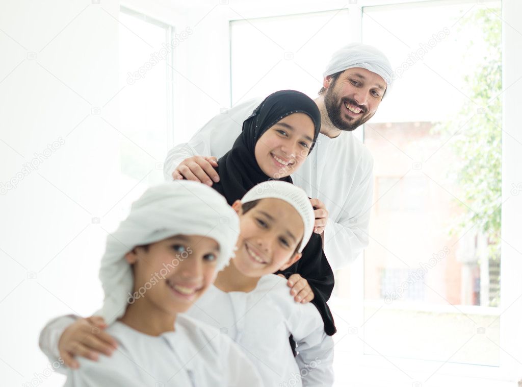 Happy Arabic family having fun