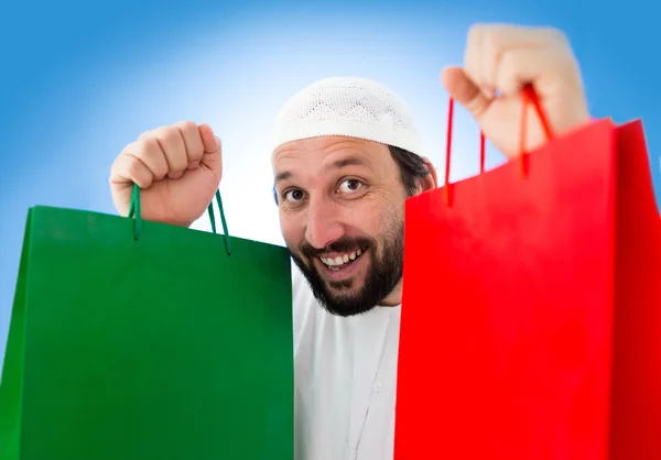 Arabische man met shopping tassen — Stockfoto