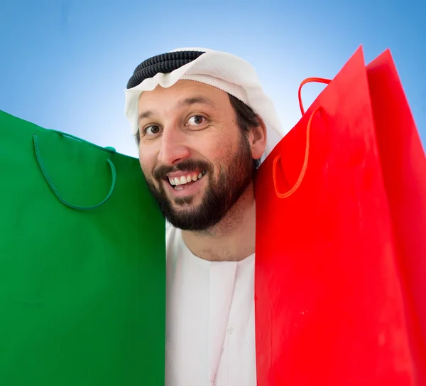 Arap adam alışveriş torbaları ile — Stok fotoğraf