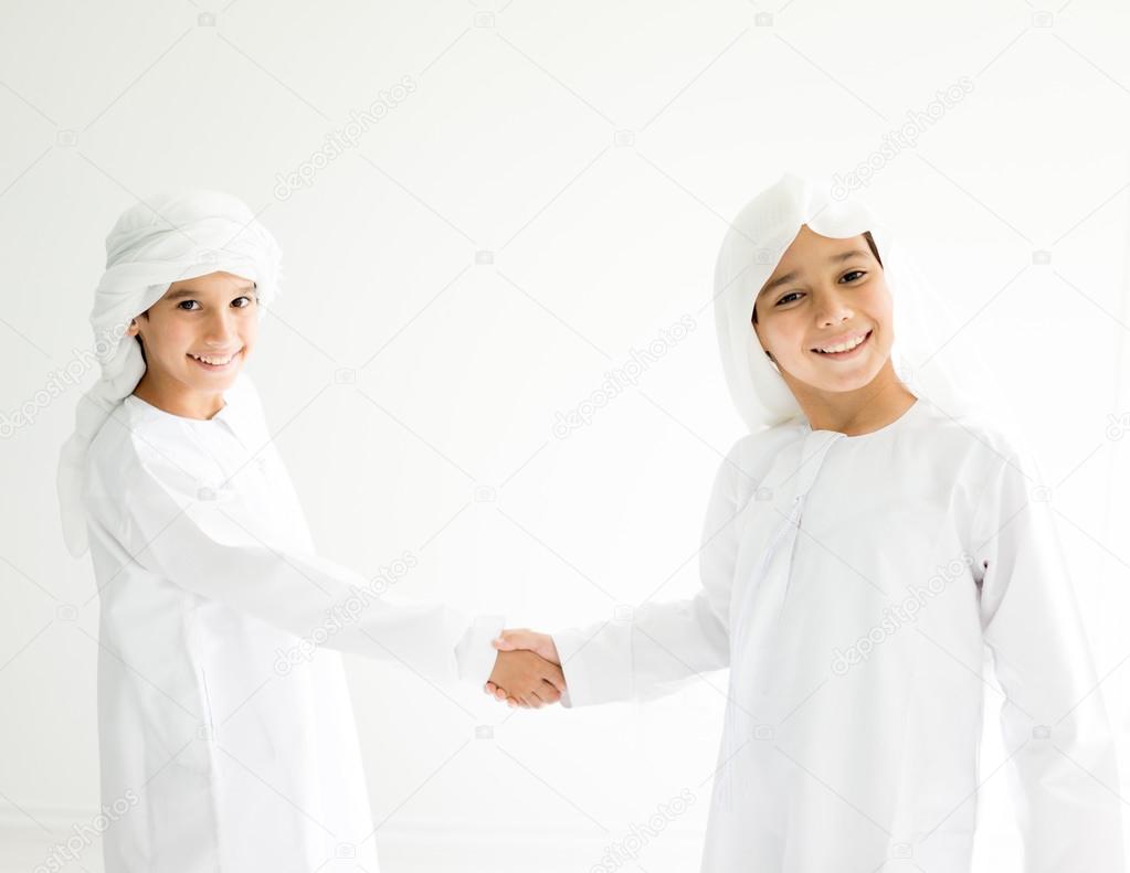 Two Arabic brothers together at home