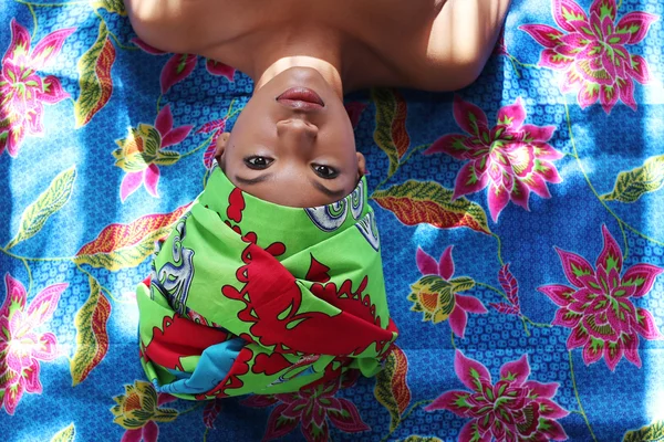 woman in green head wrap