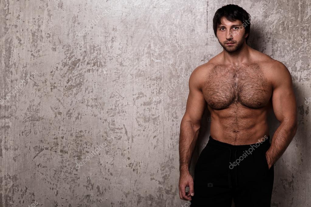 Shirtless bodybuilder with hairy chest — Stock Photo © yekophotostudio