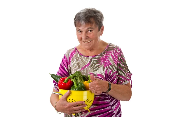 Starší žena se zeleninou — Stock fotografie