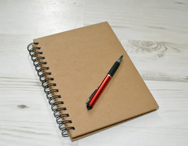 Back to school-notebook and pen — Stock Photo, Image