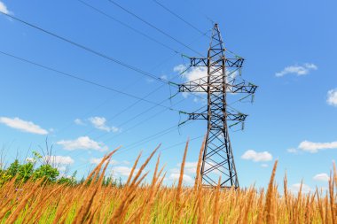 High voltage line and blue sky clipart