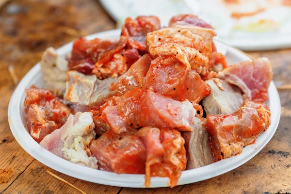 Raw meat on plate — Stock Photo, Image