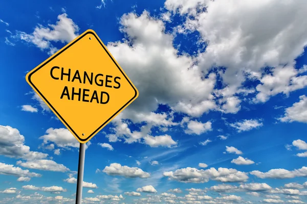 Blue cloudy sky and yellow sign — Stock Photo, Image