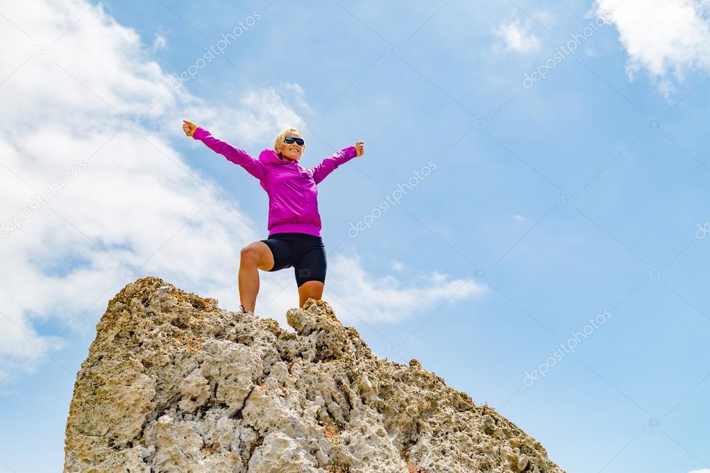 Happy trail runner winner reaching life goal success woman