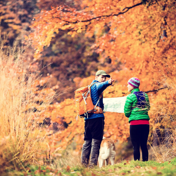 Vintage instagram couple hiking in autumn forest