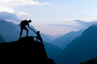 Teamwork couple climbing helping hand clipart