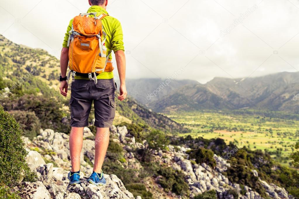 Hiking man looking at beautiful mountains