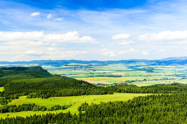 Summer landscape with green forest and beautiful inspirational landscape and mountains. Blue sky and white clouds, Poland Europe.
