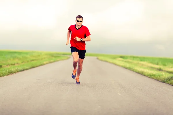 Hombre corriendo y ejercitando un estilo de vida saludable Imagen de stock