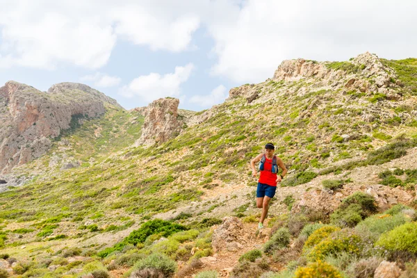 Trail running man in inspirational mountains — Stock Photo, Image