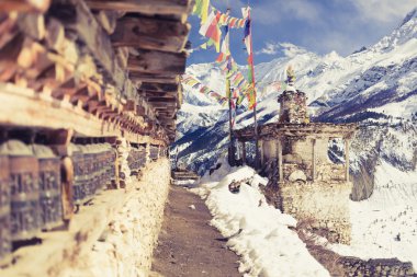 Prayer wheels in high Himalaya Mountains, Nepal village