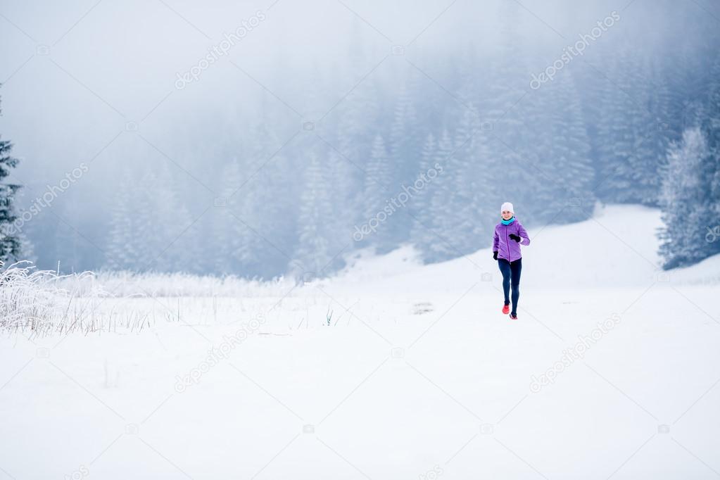 Winter running woman, jogging inspiration and motivation