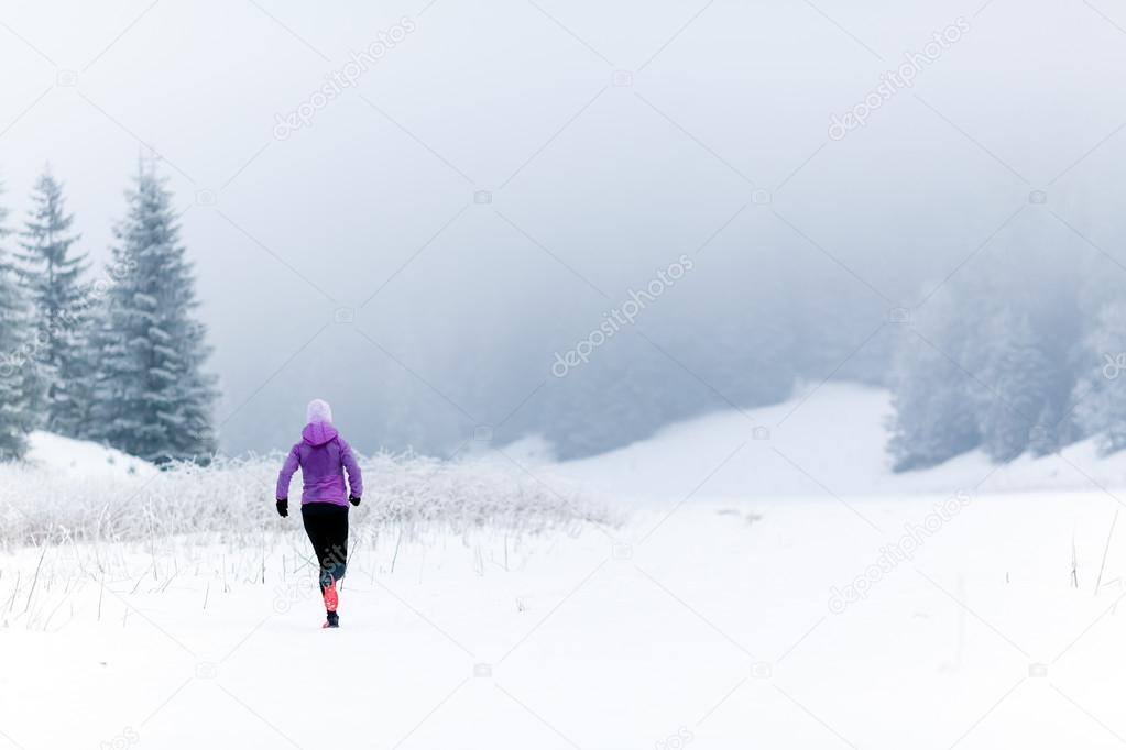 Winter running woman, jogging inspiration and motivation
