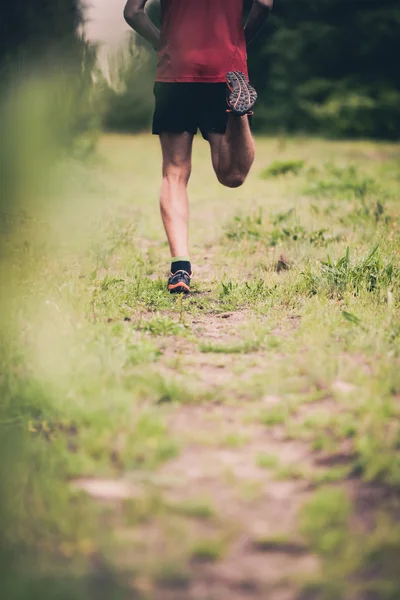 Man runner cross country running on trail — Stockfoto