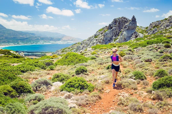 Happy woman trail running in beautiful inspirational landscape — 스톡 사진