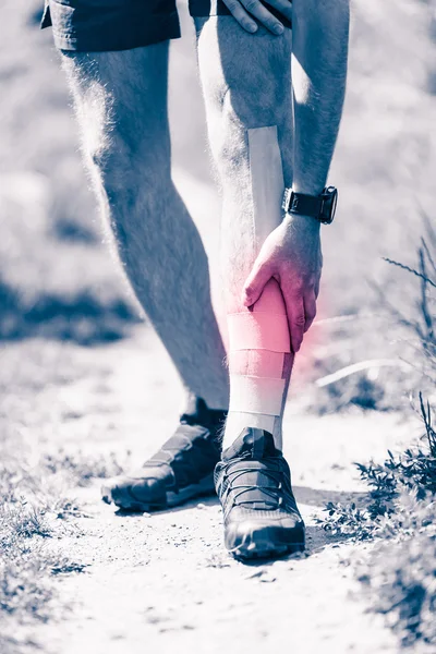 Runner leg pain, training with kinesiotape tape — Stock Photo, Image