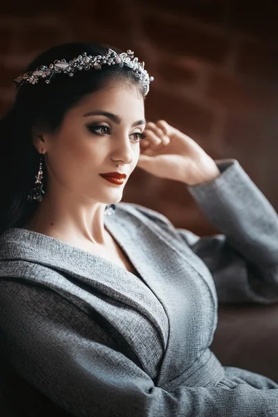 Young woman with makeup in crown — Stock Photo, Image