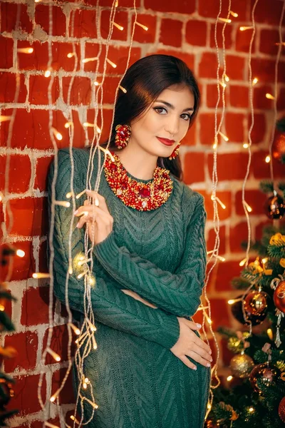 Woman near Christmas tree — Stock Photo, Image